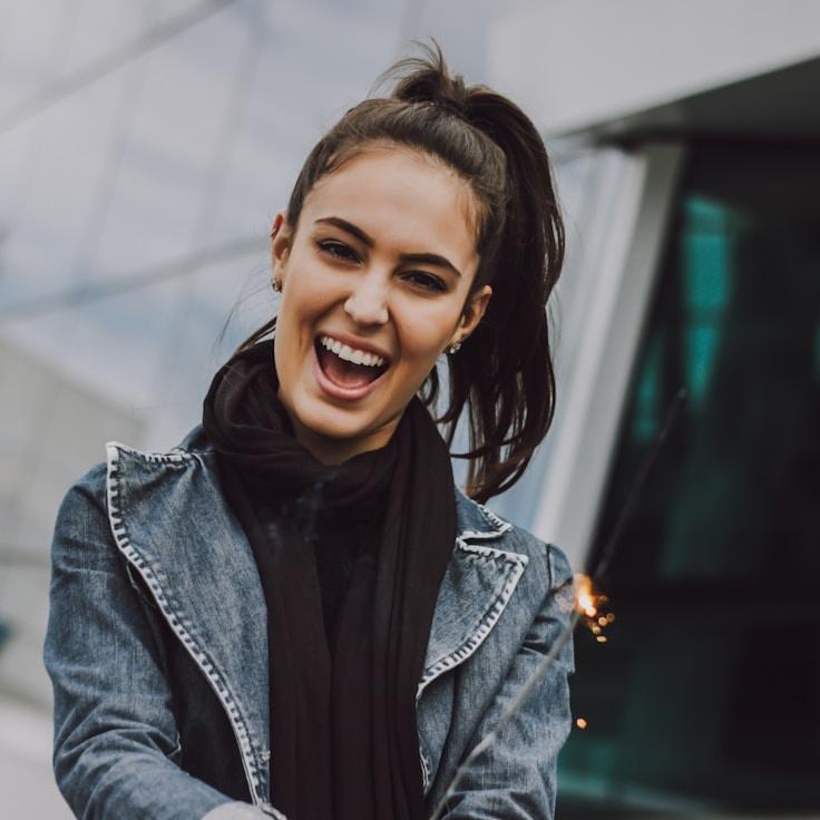 Avery Singh, Lead Design Curator at Timber Woven Harbor, reviewing corporate floral arrangements